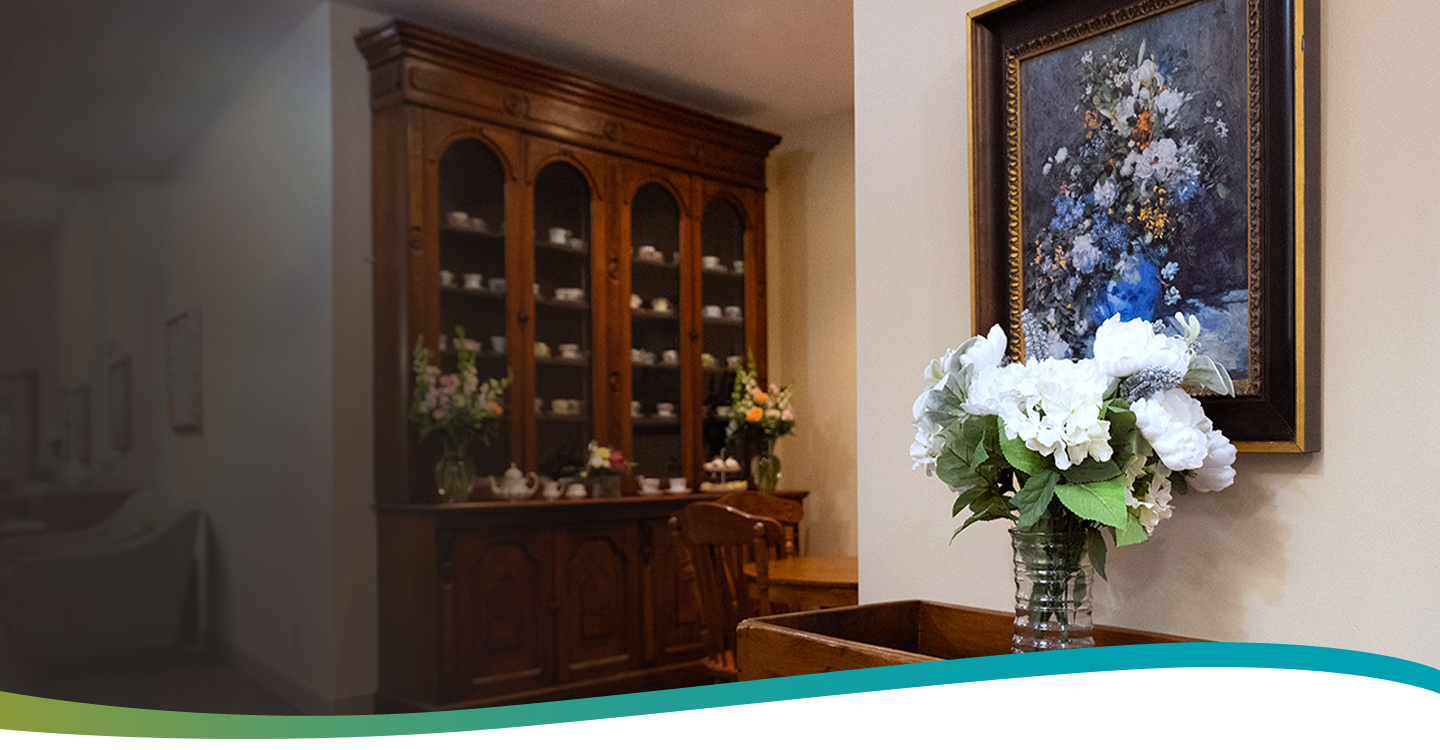 Shared space with hall table and floral arrangement at Atrium Retirement Residence in Orillia.
